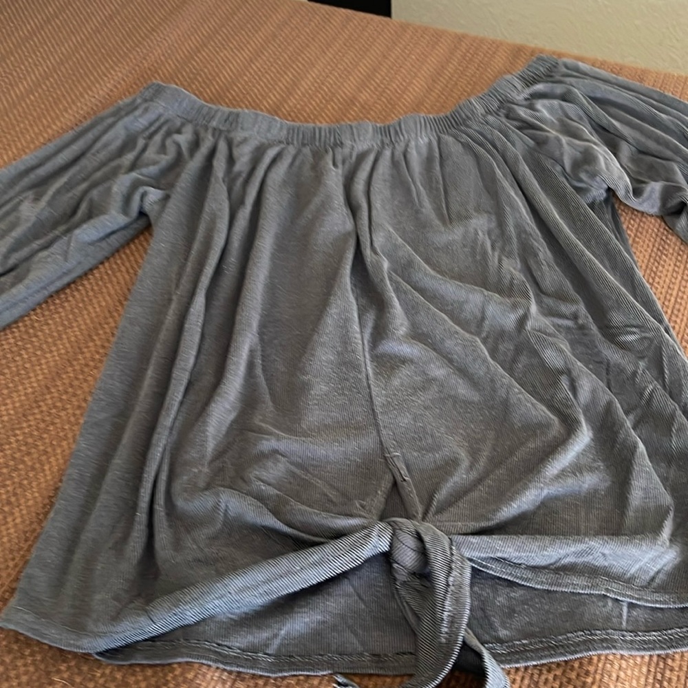 Women’s “Mind Code long sleeve cut top with tie on bottom of hem, gently used.